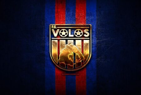volos fc golden logo super league greece blue metal background football scaled.jpg .pagespeed.ce .I l3h246Qh